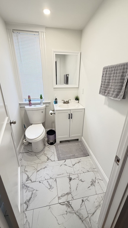 174 Boston Street, Unit 3 Boston, MA 02125 - Photo 7 of 13 a bathroom with a sink toilet and mirror