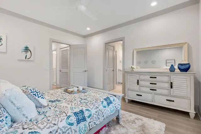 a bedroom with a bed and a dresser