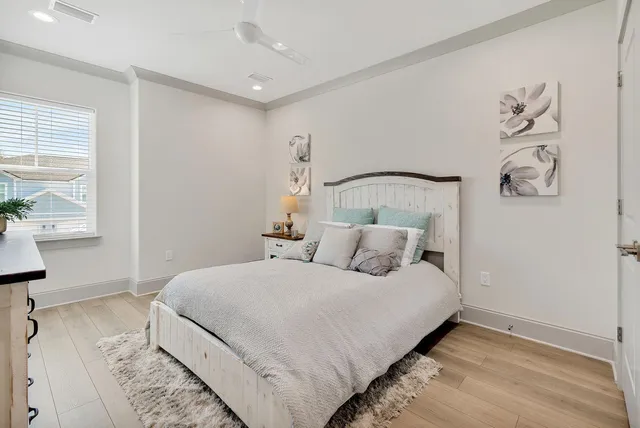 a bedroom with a large bed and a window