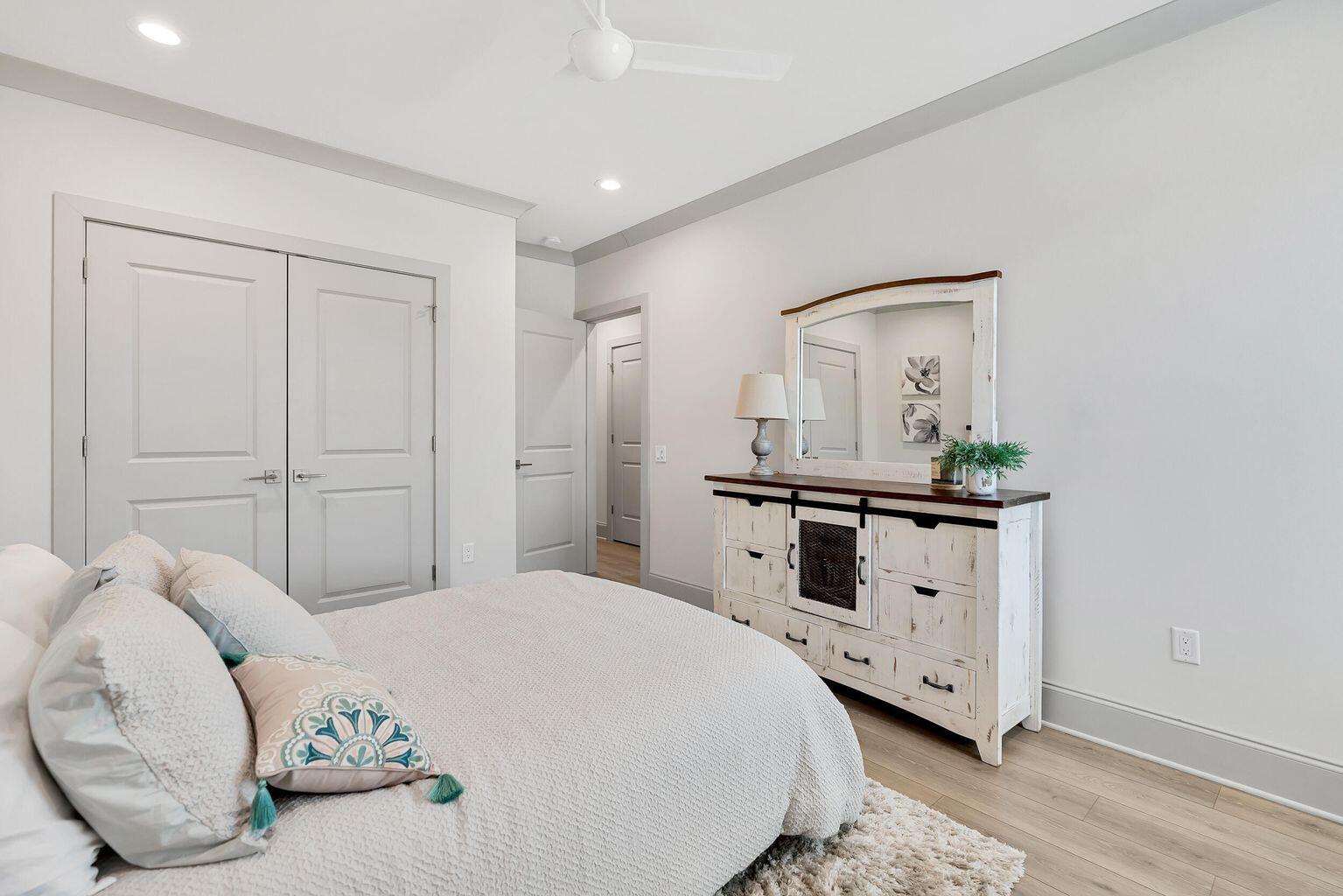 75 Golden Bell Ct Inlet Beach, Unit D Inlet Beach, FL 32461 - Photo 23 of 32 a bedroom with a bed and a dresser