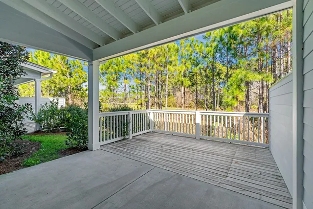 a view of a porch with wooden fence