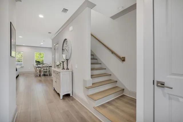 a view of entryway with livingroom and wooden floor