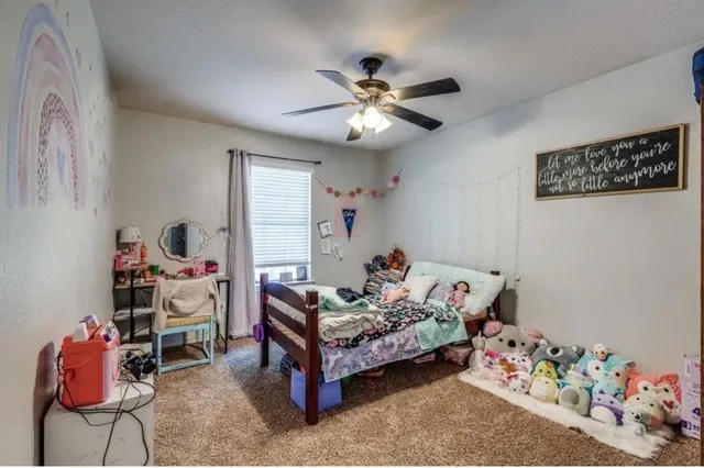 a bedroom with furniture and a bed