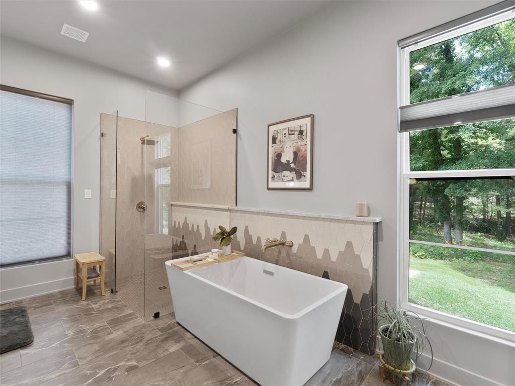 800 John Dean Road Gilmer, TX 75644 - Photo 25 of 40 a white bath tub sitting next to a white sink