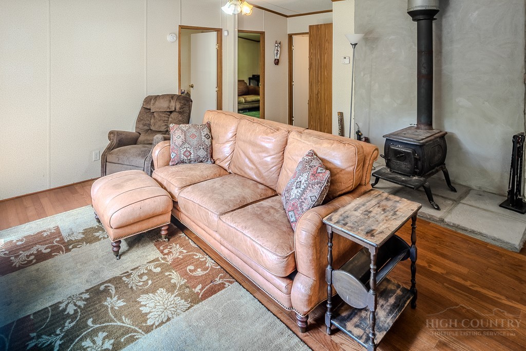 461 Reuben Wooten Road Banner Elk, NC 28604 - Photo 11 of 39 a living room with furniture and a rug