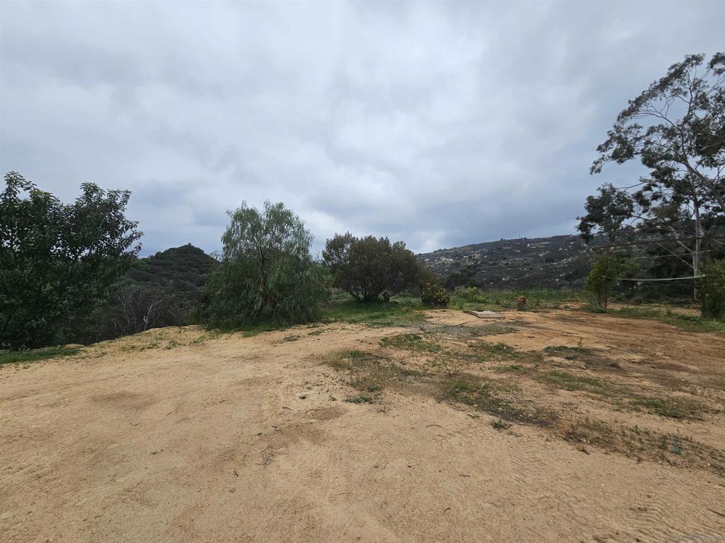 6465 Rainbow Heights Road Fallbrook, CA 92028 - Photo 2 of 36 a view of dirt field and trees around