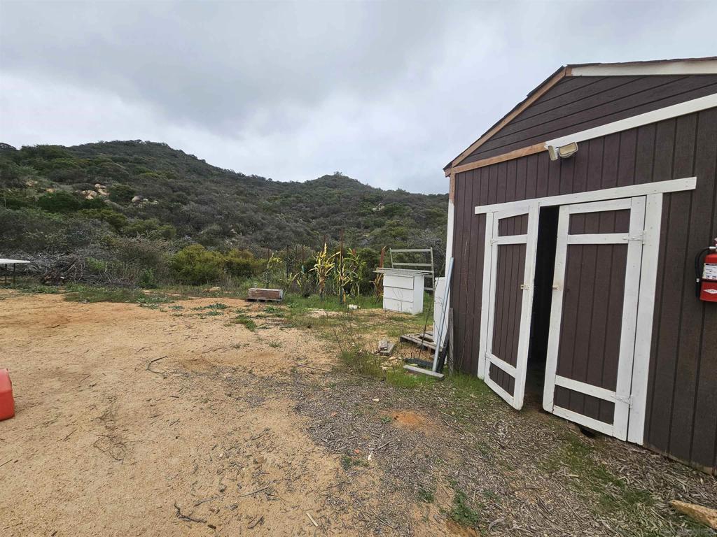 6465 Rainbow Heights Road Fallbrook, CA 92028 - Photo 29 of 36 a view of a house with a yard