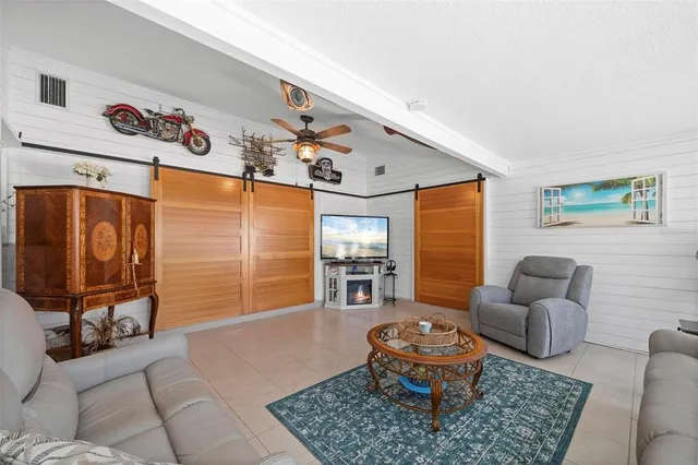 a bathroom with a granite countertop toilet sink and mirror