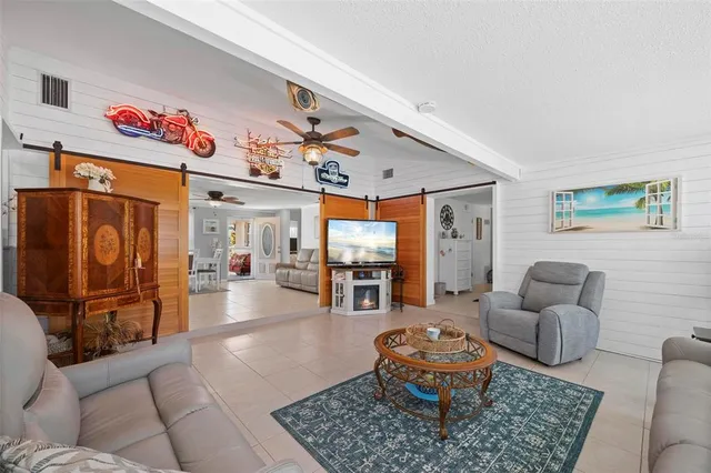 a en suite bathroom with a granite countertop sink and a mirror