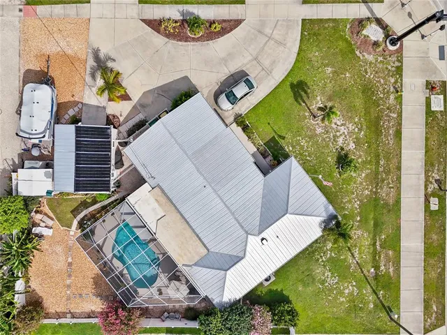 a view of a dining room with furniture and a chandelier fan
