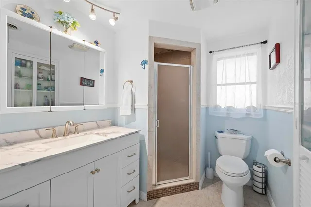 a view of a city that has tall buildings and a big yard