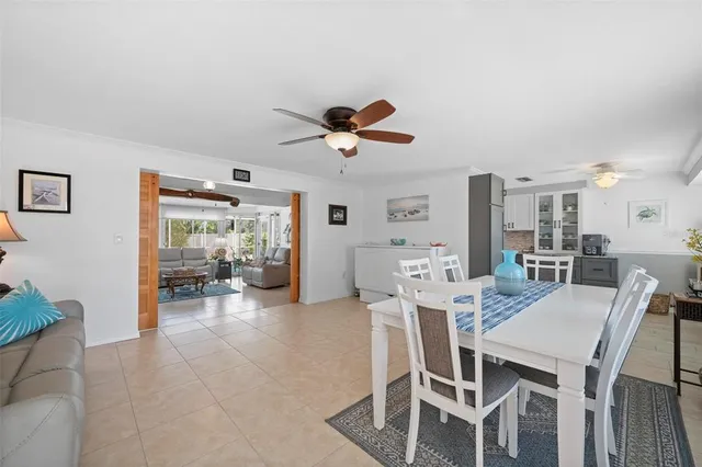 a large kitchen with stainless steel appliances granite countertop a stove a sink dishwasher and a refrigerator