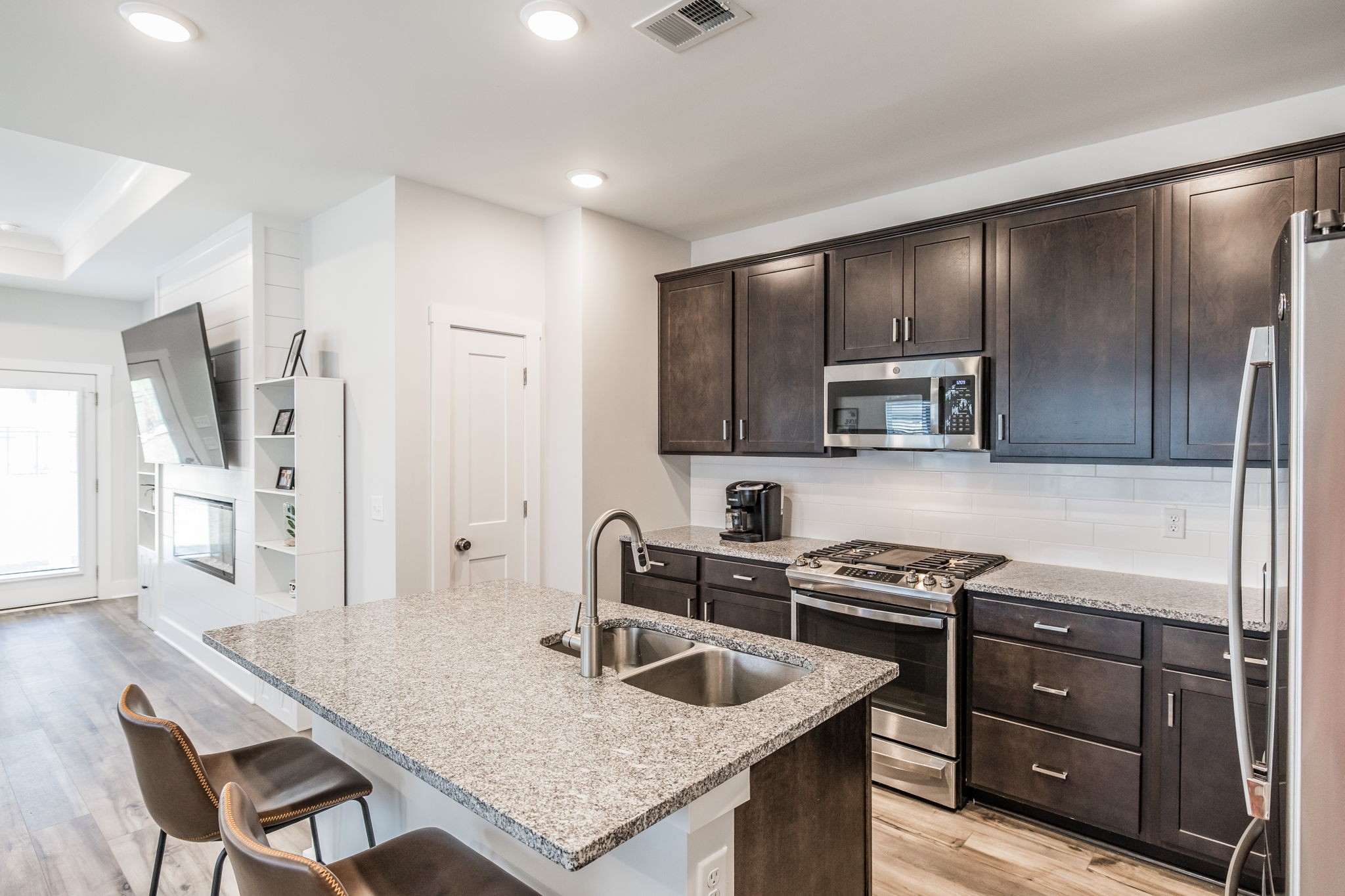137 Cavalcade Loop Gallatin, TN 37066 - Photo 16 of 57 a kitchen with stainless steel appliances granite countertop a sink stove and refrigerator