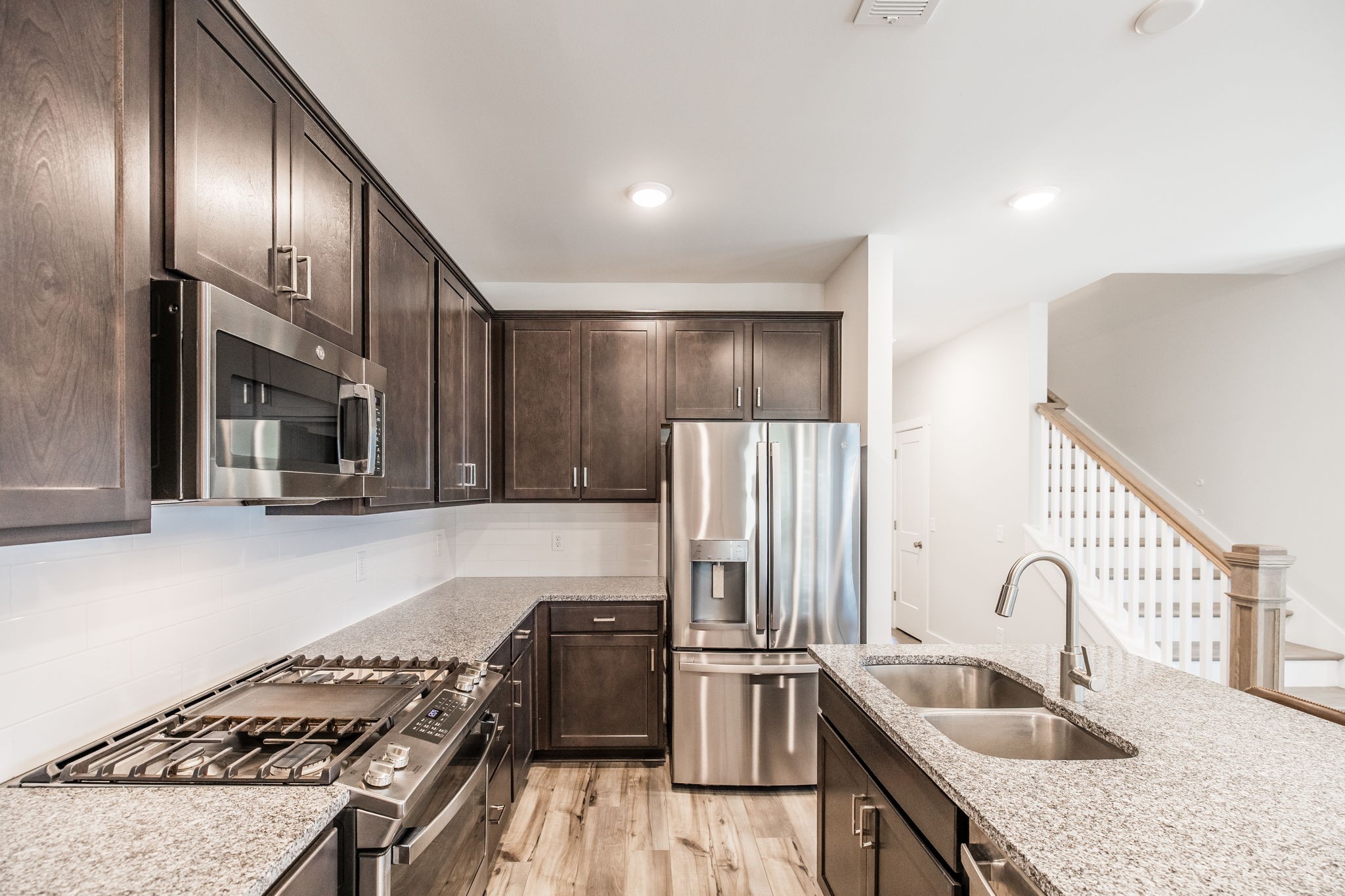 137 Cavalcade Loop Gallatin, TN 37066 - Photo 17 of 57 a kitchen with granite countertop stainless steel appliances and a sink