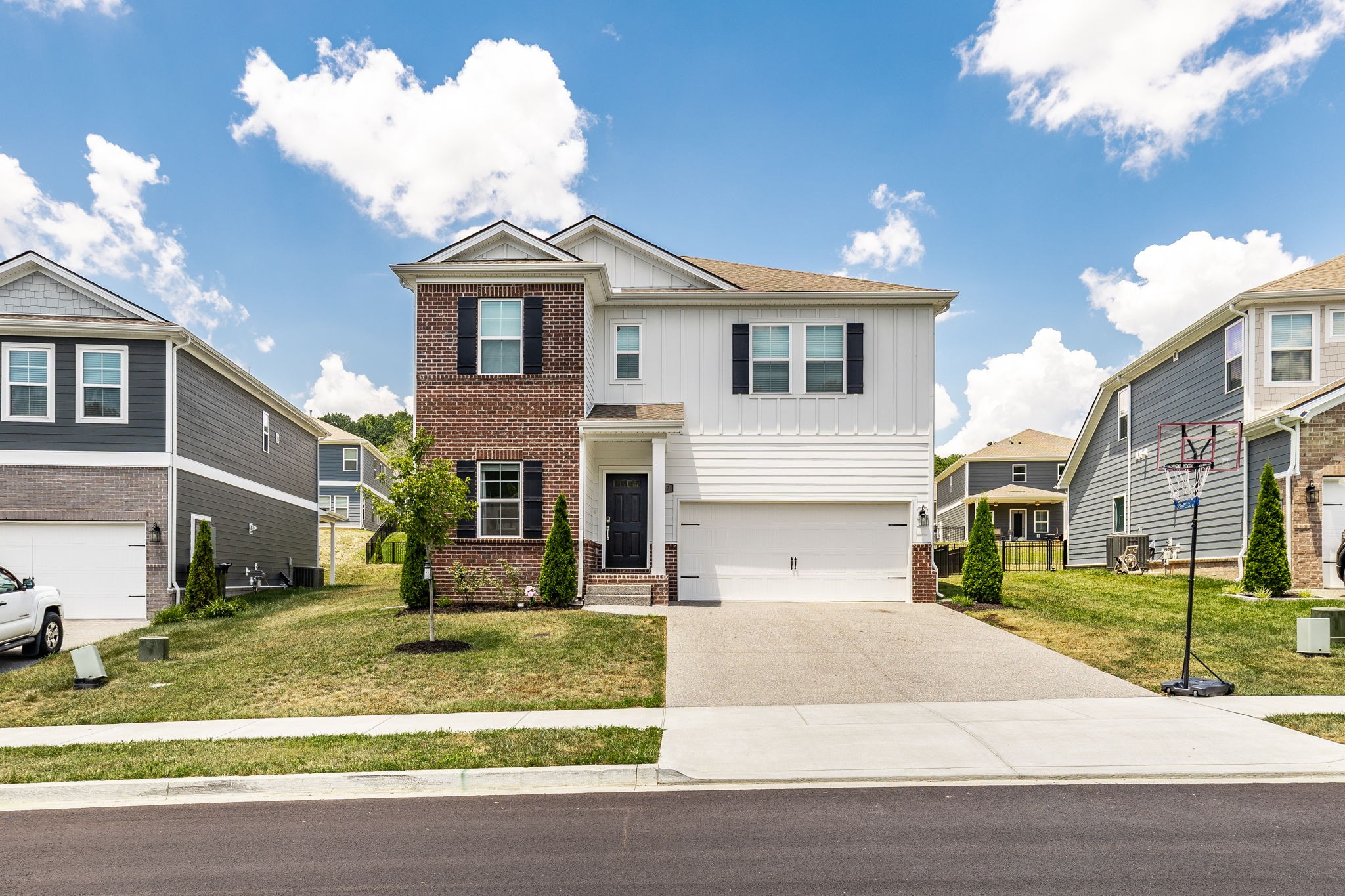 137 Cavalcade Loop Gallatin, TN 37066 - Photo 2 of 57 a front view of a house with garden