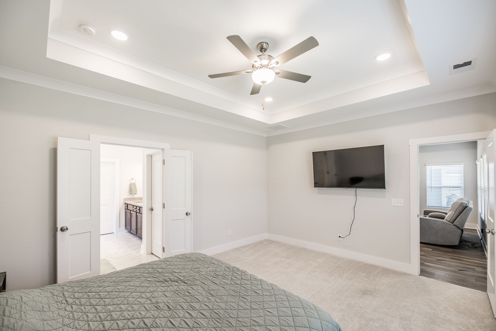 137 Cavalcade Loop Gallatin, TN 37066 - Photo 28 of 57 a bedroom with a bed and a flat screen tv