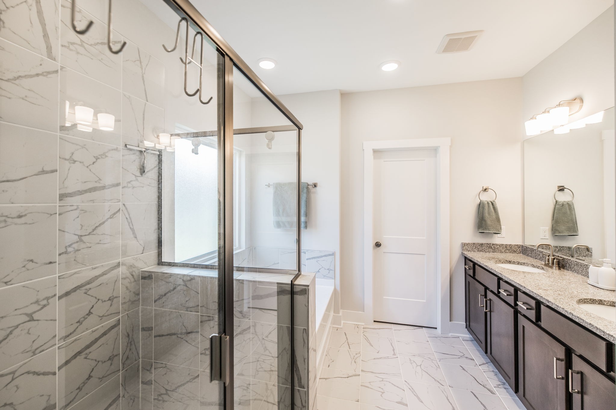 137 Cavalcade Loop Gallatin, TN 37066 - Photo 29 of 57 a bathroom with a mirror and a shower