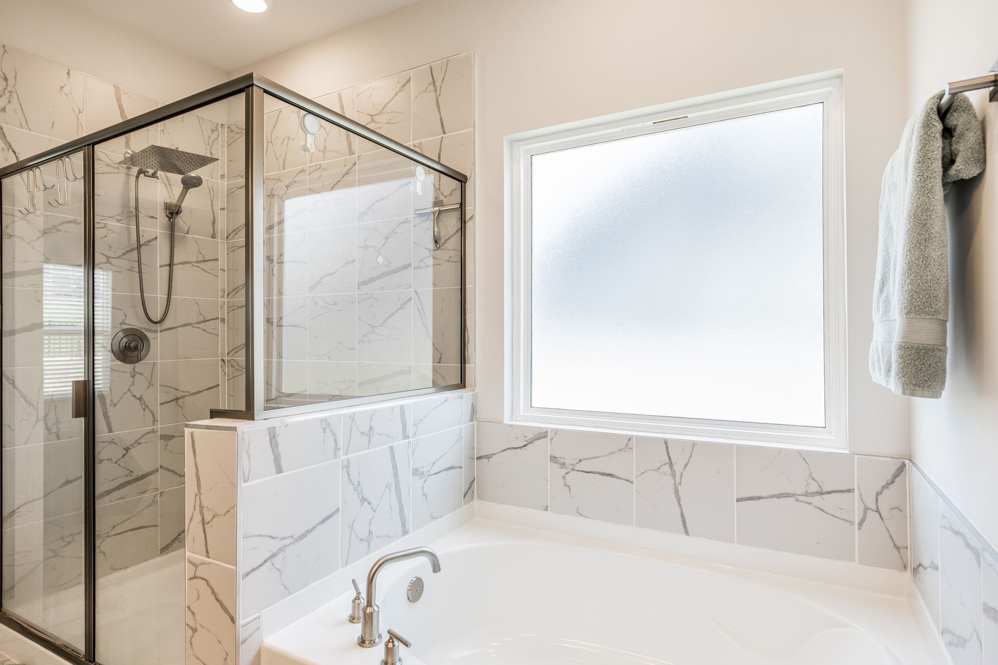 137 Cavalcade Loop Gallatin, TN 37066 - Photo 31 of 57 a bathroom with a bathtub and a shower