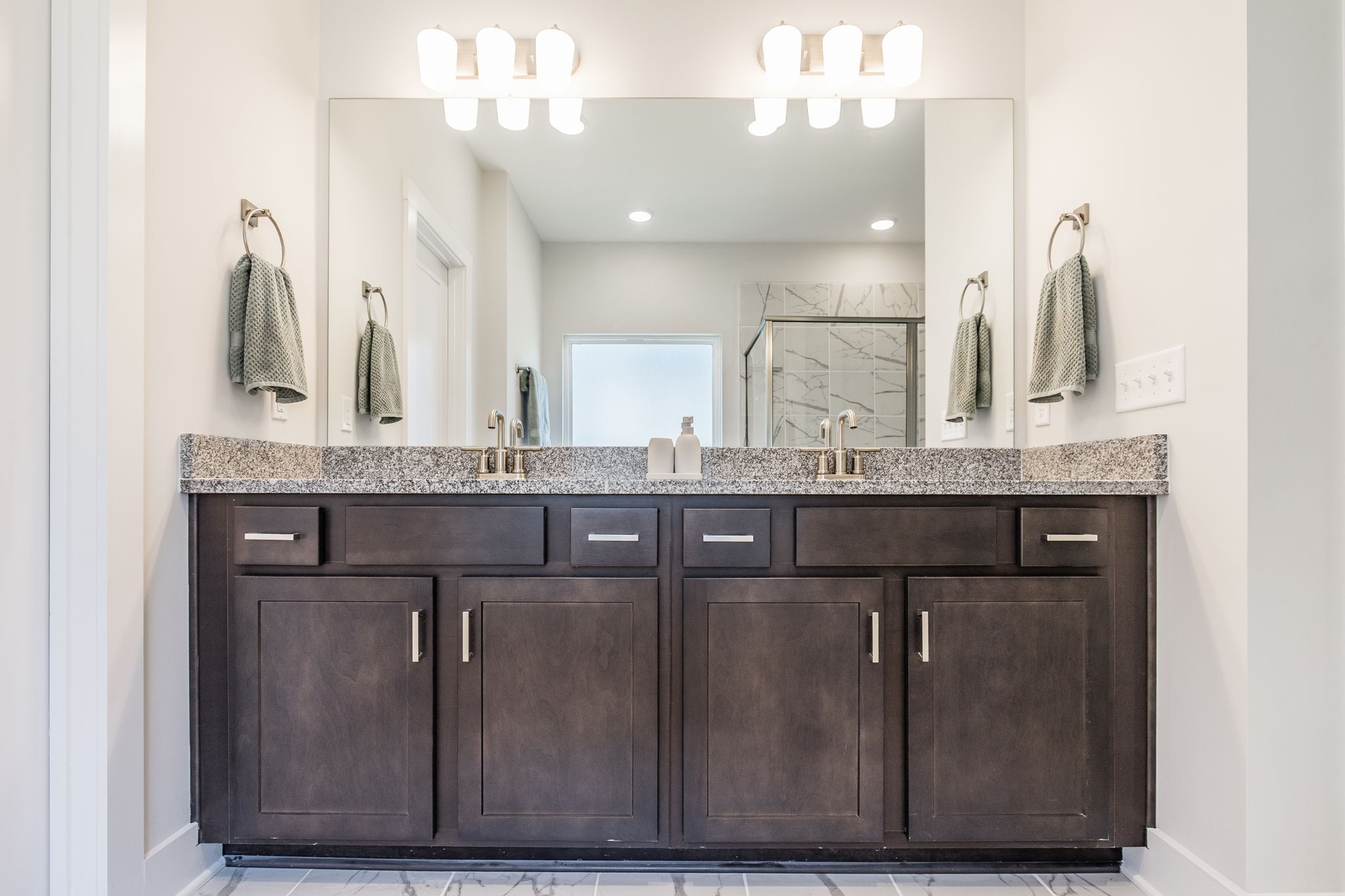 137 Cavalcade Loop Gallatin, TN 37066 - Photo 33 of 57 a bathroom with a granite countertop sink a mirror and a vanity