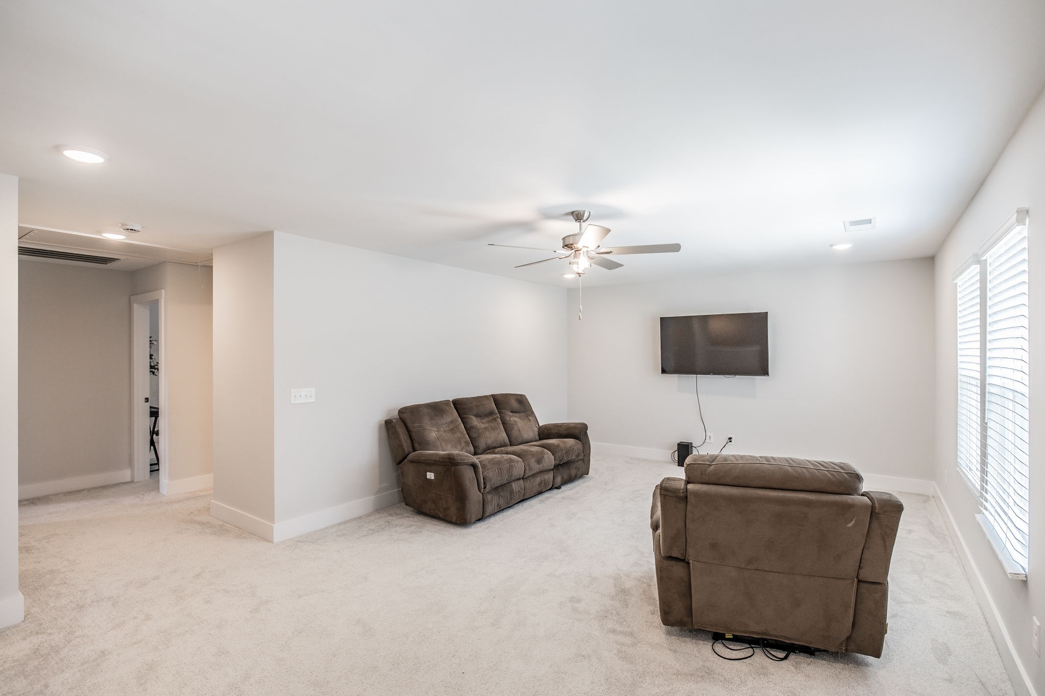 137 Cavalcade Loop Gallatin, TN 37066 - Photo 35 of 57 a living room with furniture a flat screen tv and a window