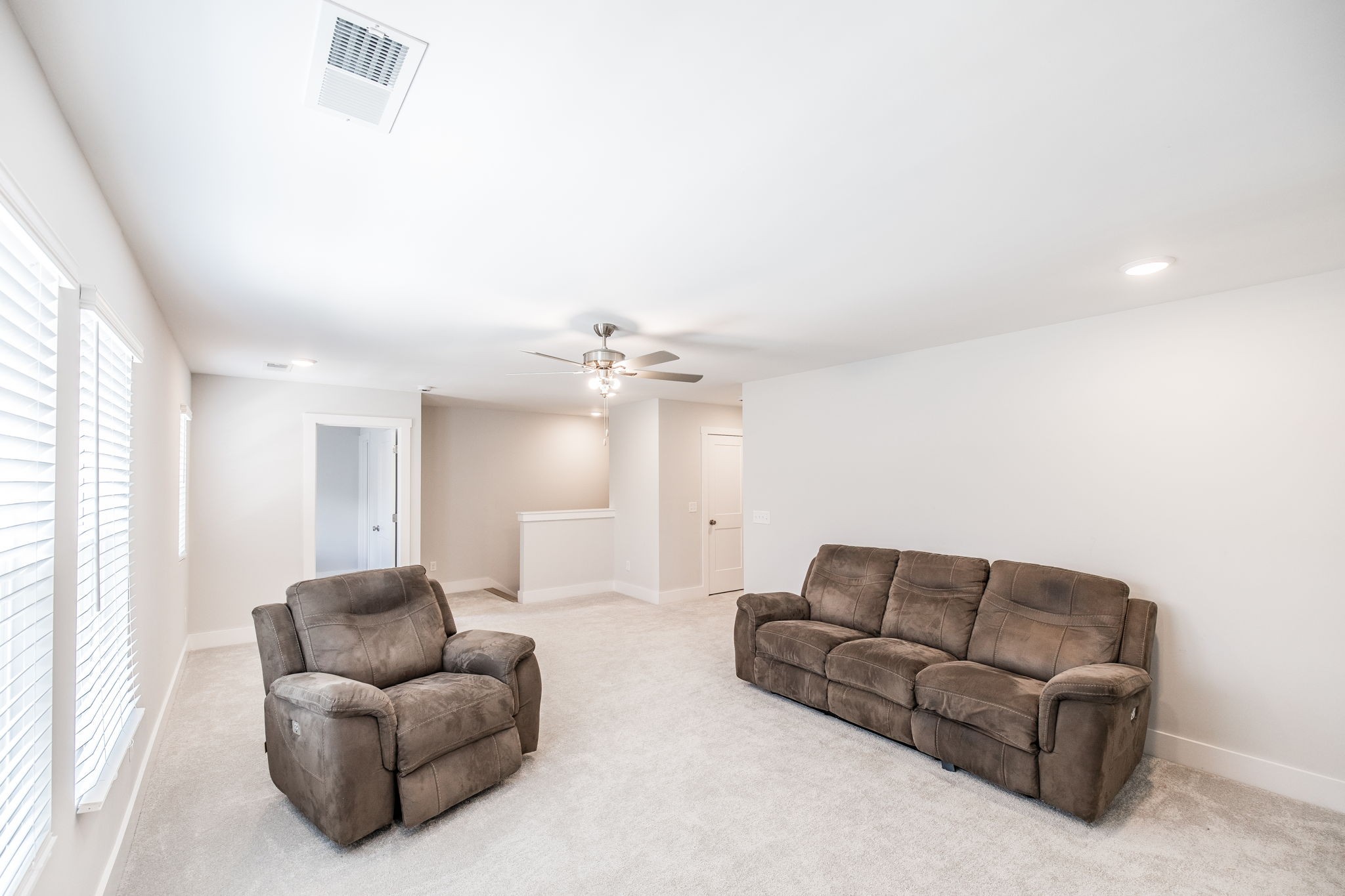 137 Cavalcade Loop Gallatin, TN 37066 - Photo 37 of 57 a living room with furniture and a chandelier