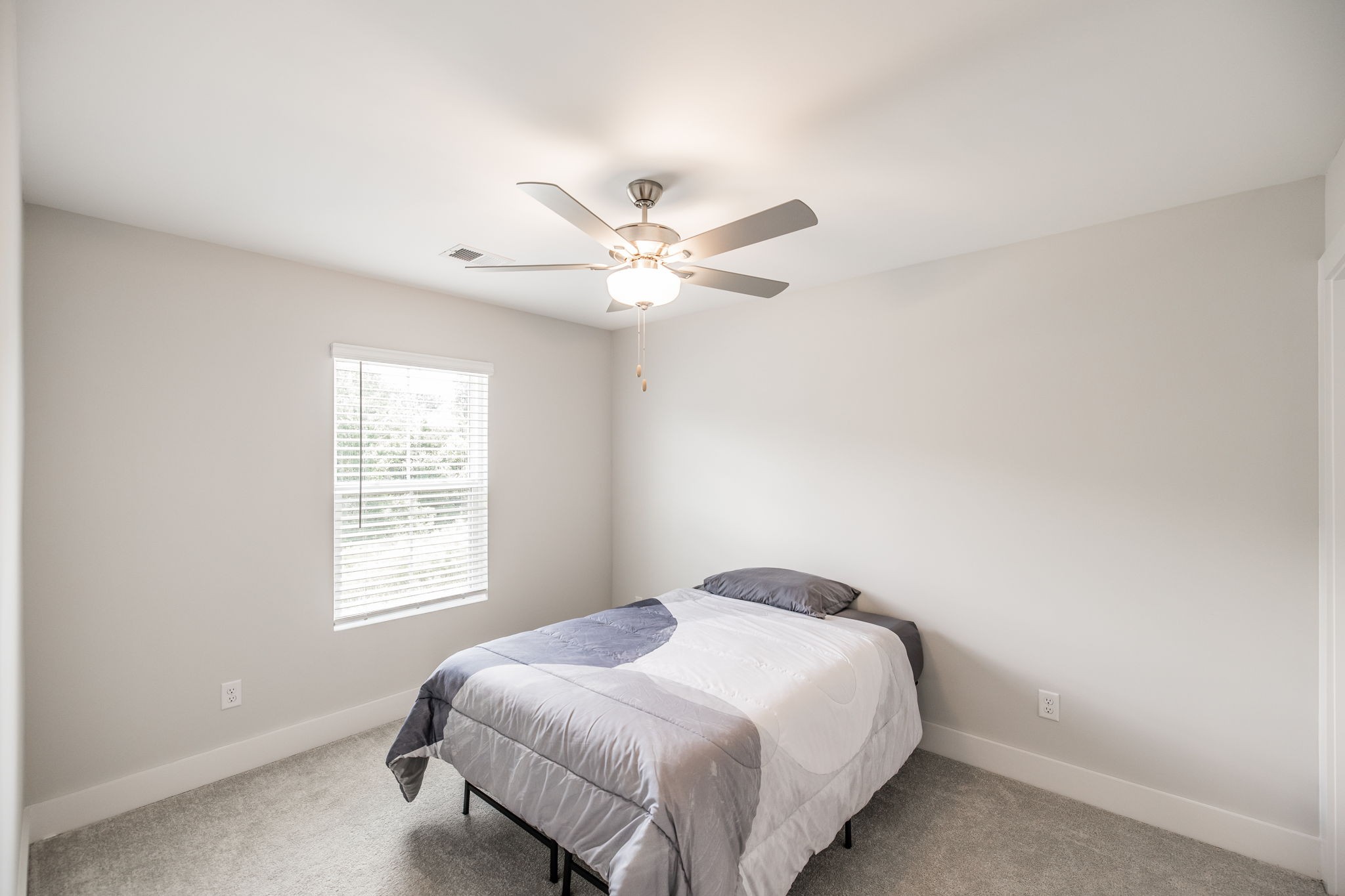 137 Cavalcade Loop Gallatin, TN 37066 - Photo 39 of 57 a bedroom with a large bed and a chandelier