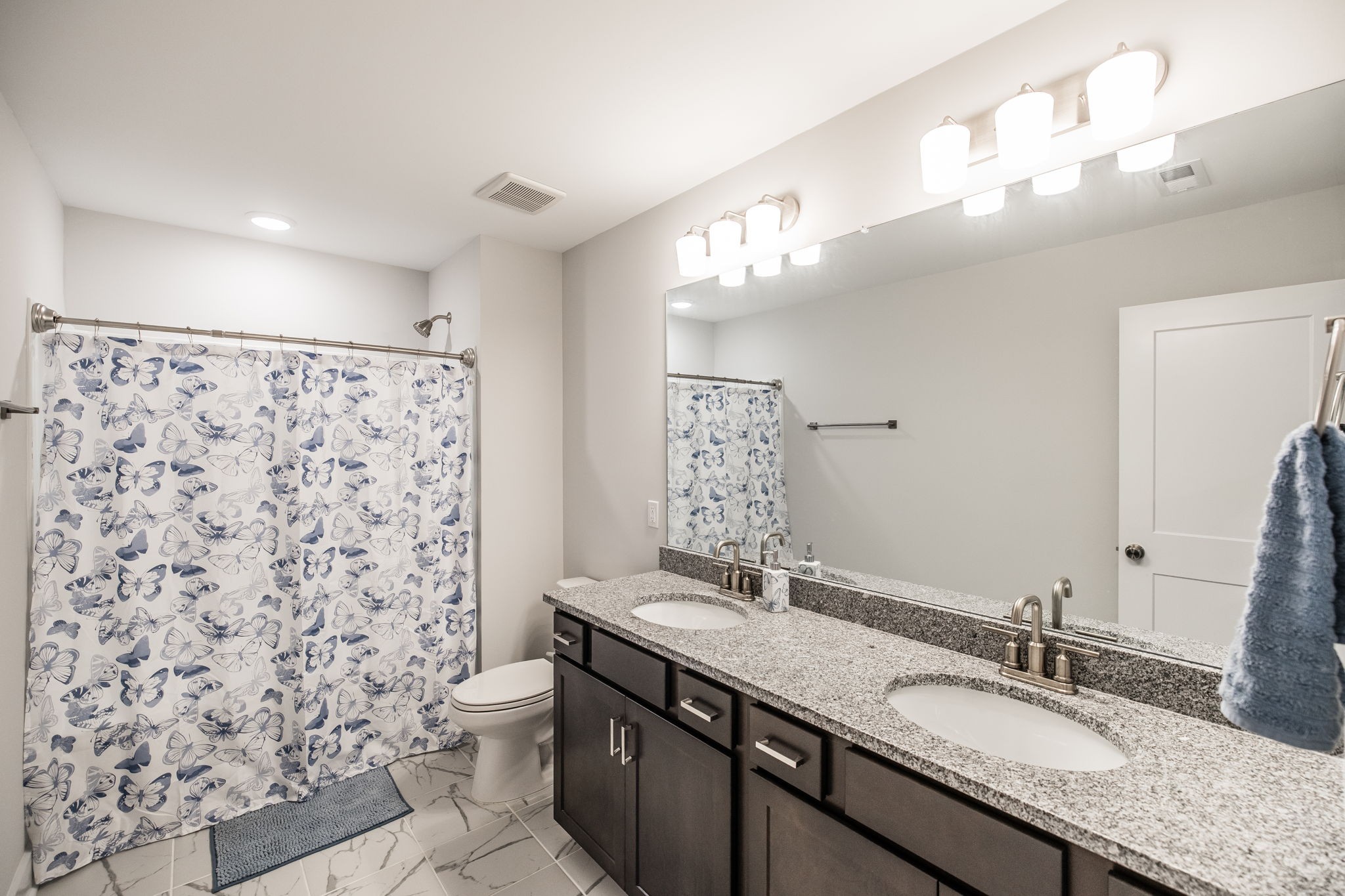 137 Cavalcade Loop Gallatin, TN 37066 - Photo 43 of 57 a bathroom with a granite countertop sink a toilet and a mirror