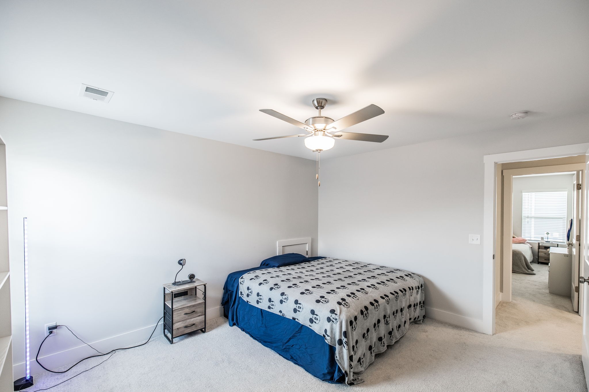 137 Cavalcade Loop Gallatin, TN 37066 - Photo 48 of 57 a bedroom with a bed and a chandelier