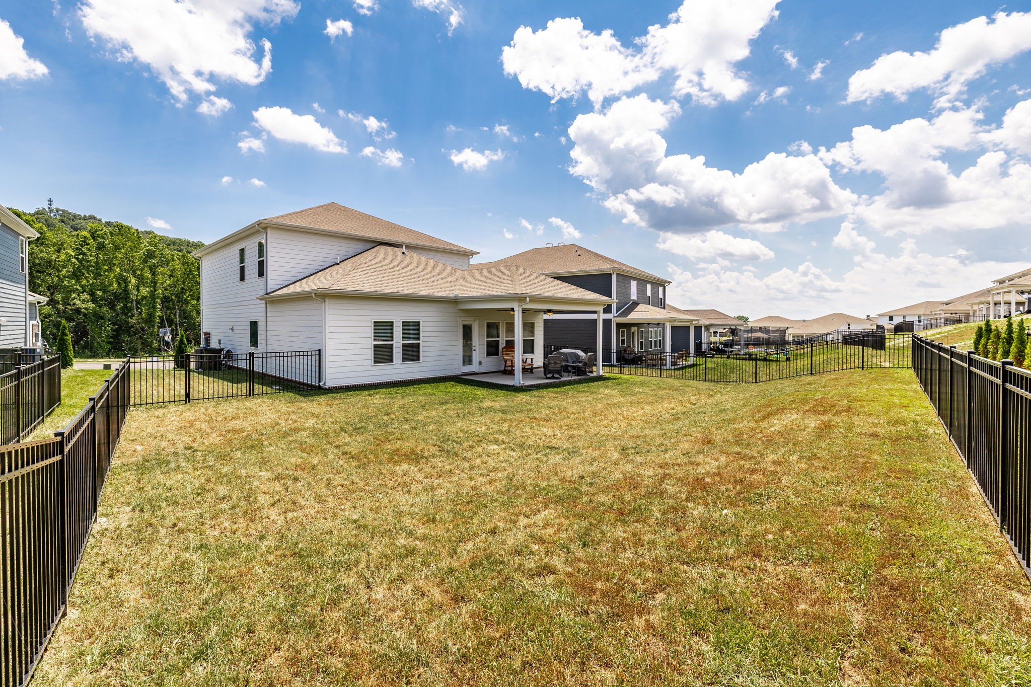 137 Cavalcade Loop Gallatin, TN 37066 - Photo 55 of 57 a front view of a house with swimming pool