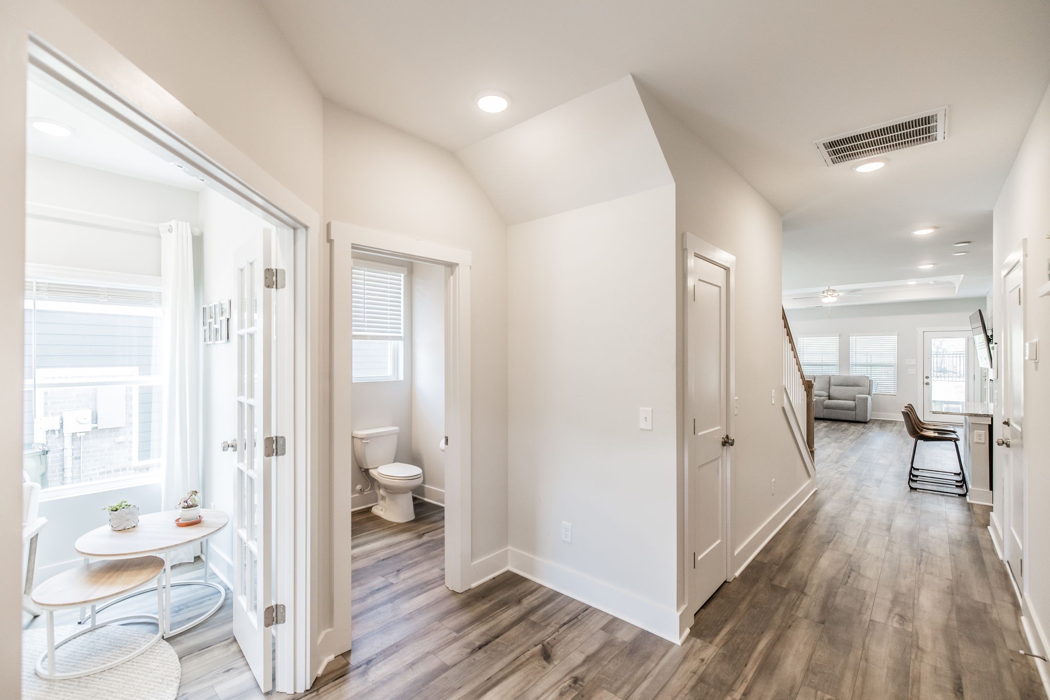137 Cavalcade Loop Gallatin, TN 37066 - Photo 7 of 57 a view of a hallway with wooden floor and a bedroom