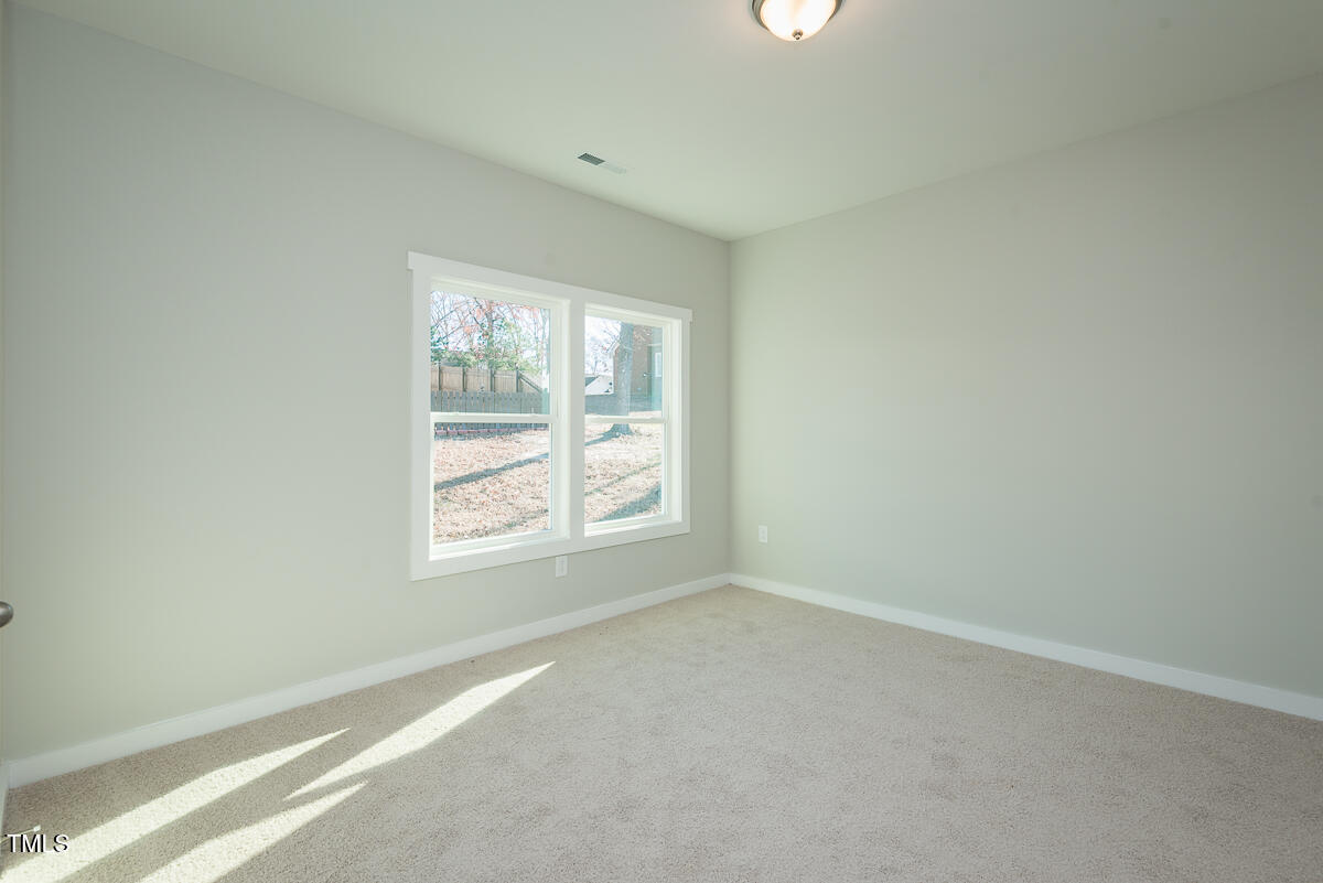 1030 Pinnix Loop Burlington, NC 27217 - Photo 13 of 25 an empty room with a window