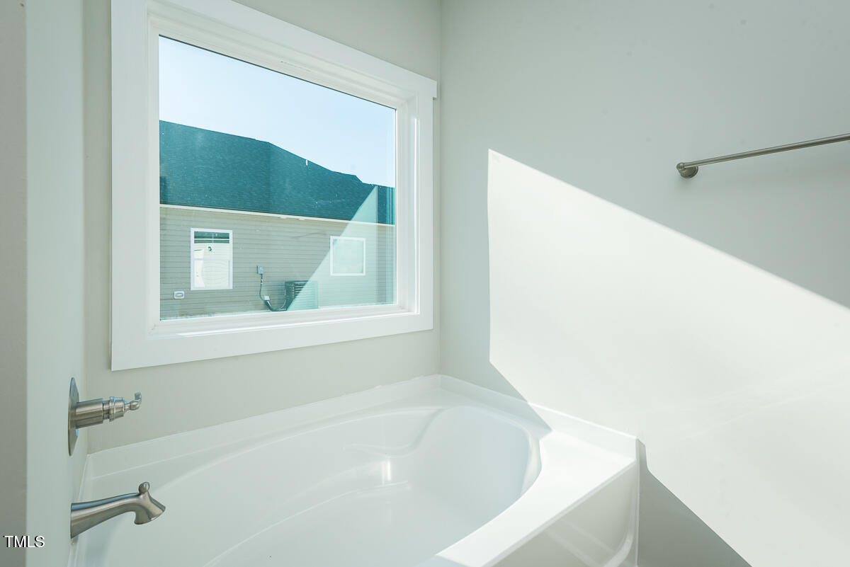 1030 Pinnix Loop Burlington, NC 27217 - Photo 17 of 25 a bathroom with a bathtub