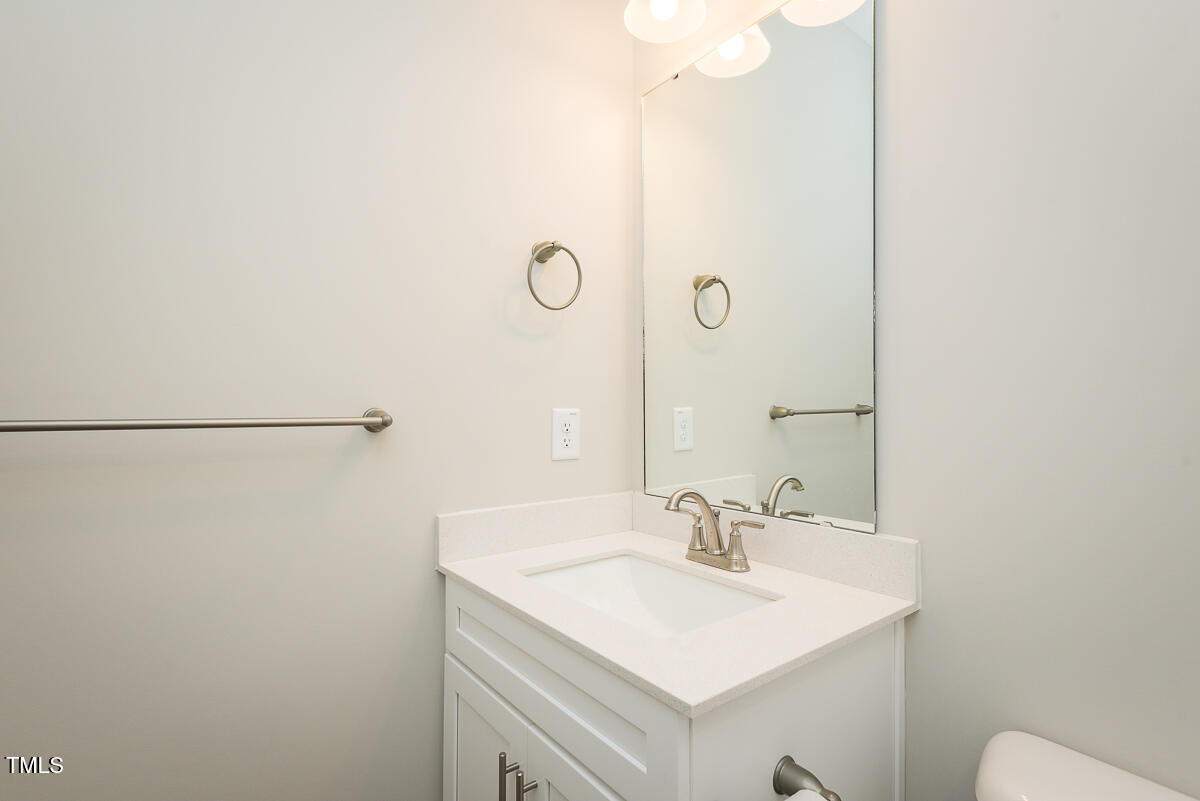 1030 Pinnix Loop Burlington, NC 27217 - Photo 19 of 25 a bathroom with a sink and a mirror