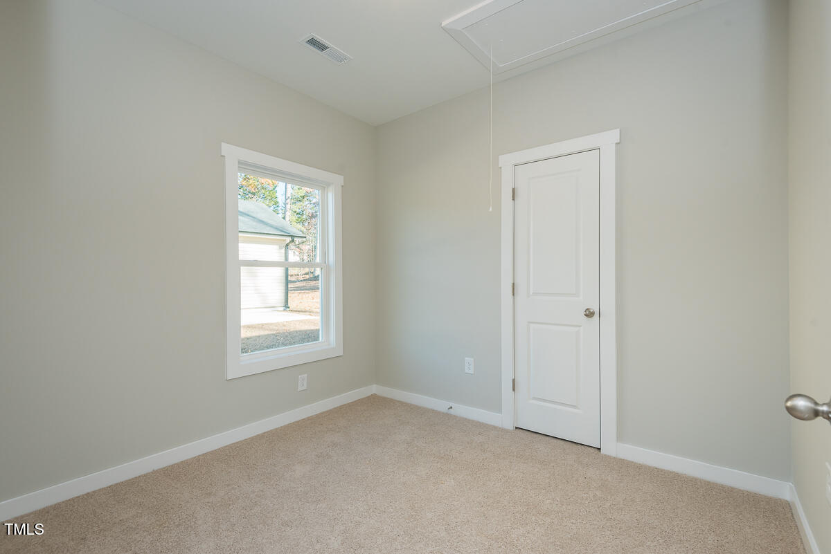 1030 Pinnix Loop Burlington, NC 27217 - Photo 20 of 25 an empty room with windows