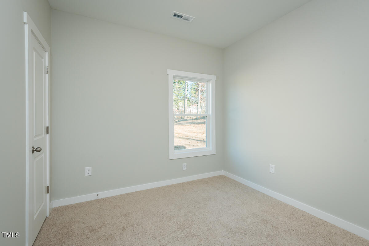 1030 Pinnix Loop Burlington, NC 27217 - Photo 21 of 25 an empty room with a window