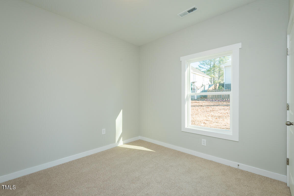 1030 Pinnix Loop Burlington, NC 27217 - Photo 22 of 25 an empty room with a window