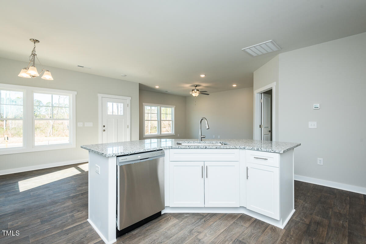 1030 Pinnix Loop Burlington, NC 27217 - Photo 9 of 25 a kitchen with a sink stove and cabinets
