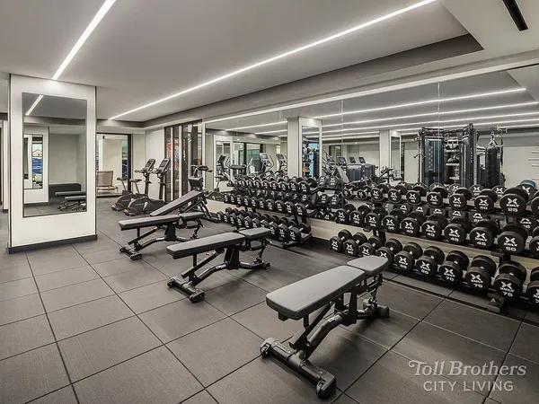 a view of a livingroom with table and chairs