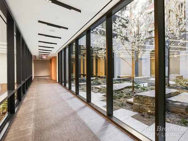 a outdoor living space with furniture kitchen view and a potted plant