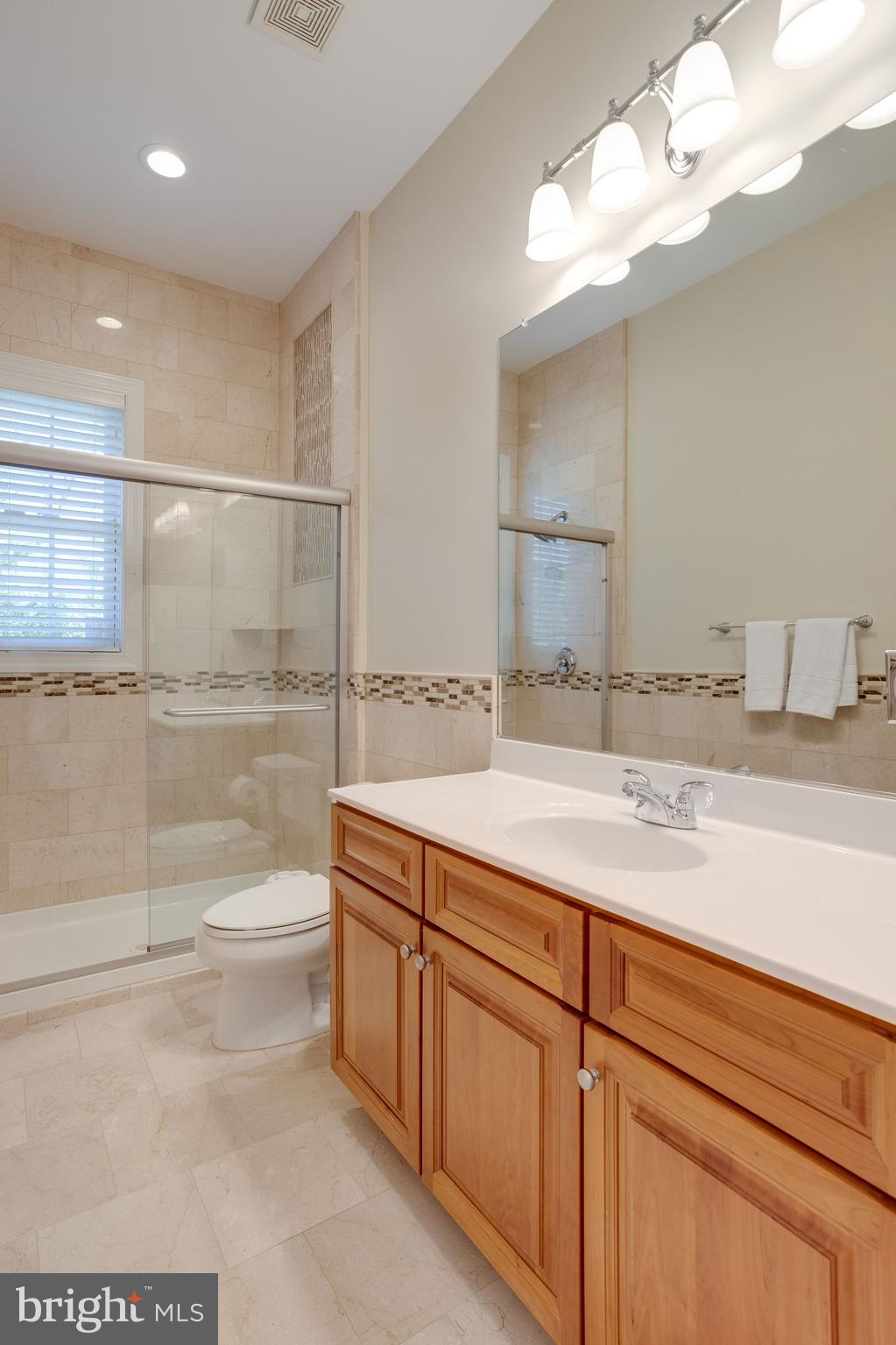 7111 Granberry Way Springfield, VA 22151 - Photo 12 of 84 Main level full bathroom adjoins office/bedrm
