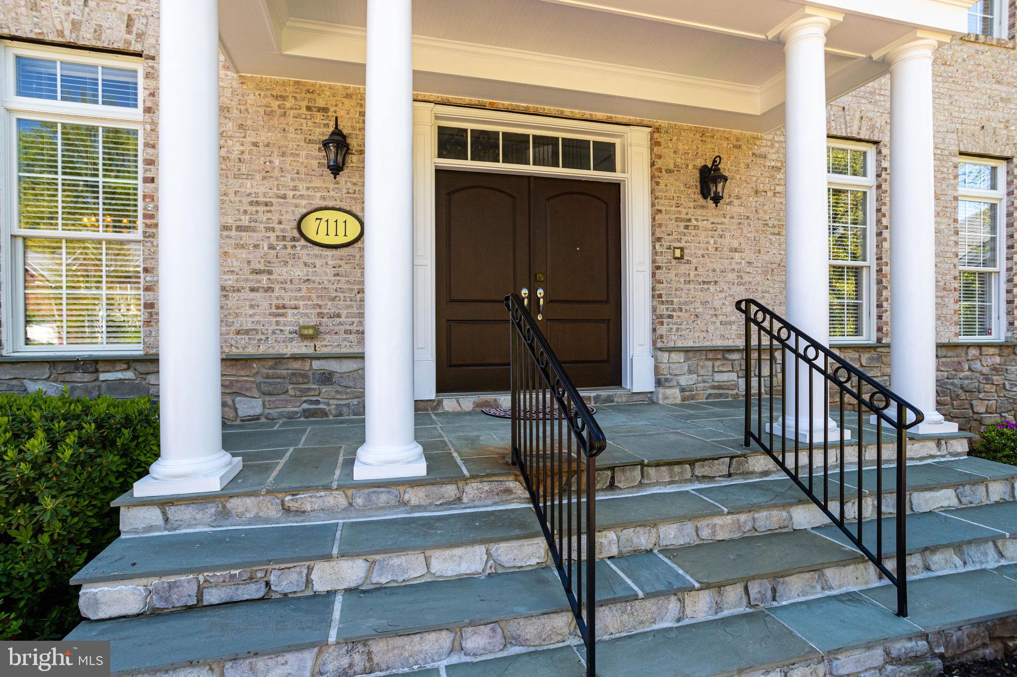 7111 Granberry Way Springfield, VA 22151 - Photo 4 of 84 Grand stonework porch welcomes your guests...