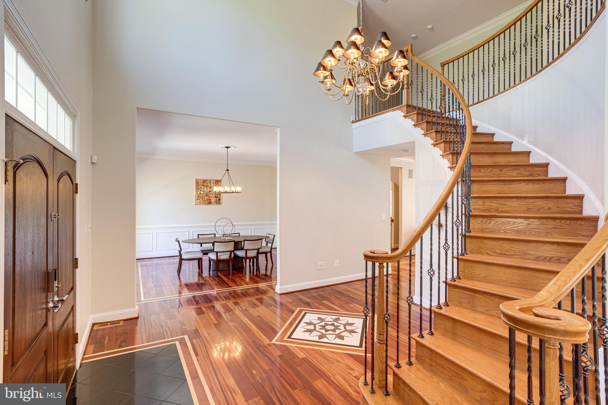 7111 Granberry Way Springfield, VA 22151 - Photo 6 of 84 Sweeping curved staircase and Brazilian floors