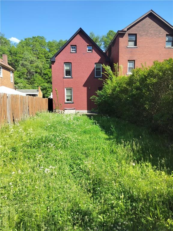 245 Fleet Street Braddock, PA 15104 - Photo 12 of 12 a front view of a house with garden