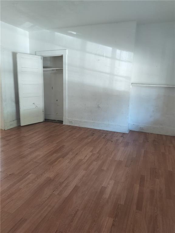 245 Fleet Street Braddock, PA 15104 - Photo 2 of 12 an empty room with wooden floor