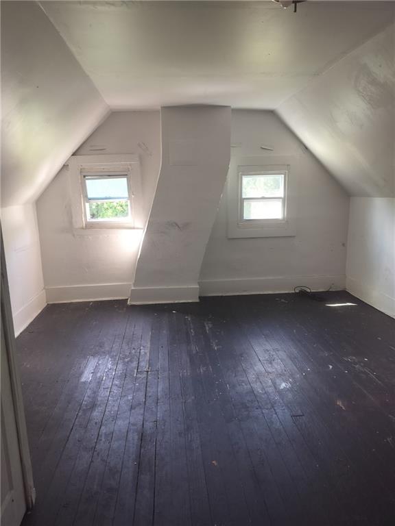 245 Fleet Street Braddock, PA 15104 - Photo 10 of 12 an empty room with wooden floor and windows