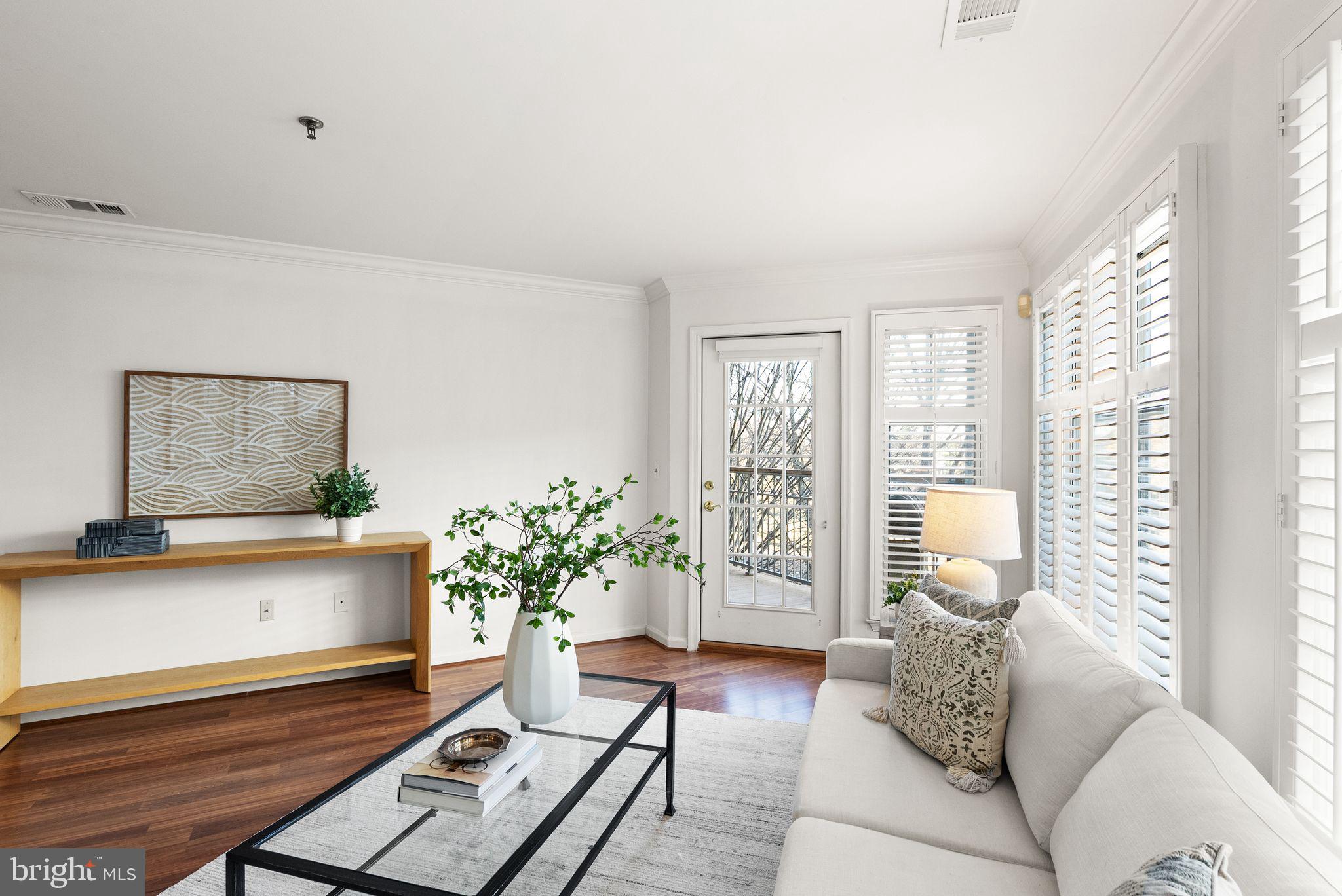 5565 Seminary Road, Unit 209 Falls Church, VA 22041 - Photo 12 of 34 a living room with furniture and a potted plant