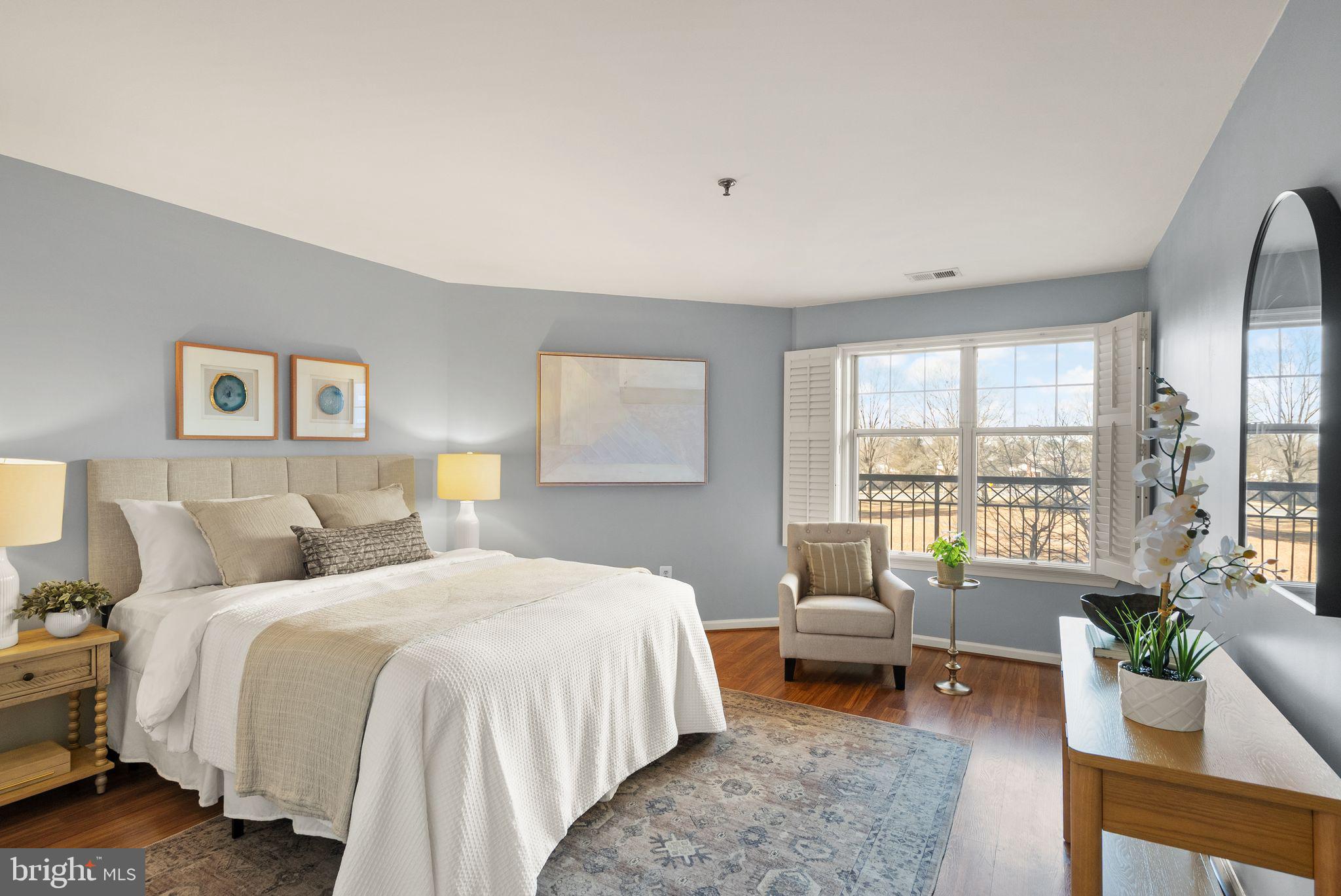 5565 Seminary Road, Unit 209 Falls Church, VA 22041 - Photo 14 of 34 a bedroom with a bed a couch and a potted plant