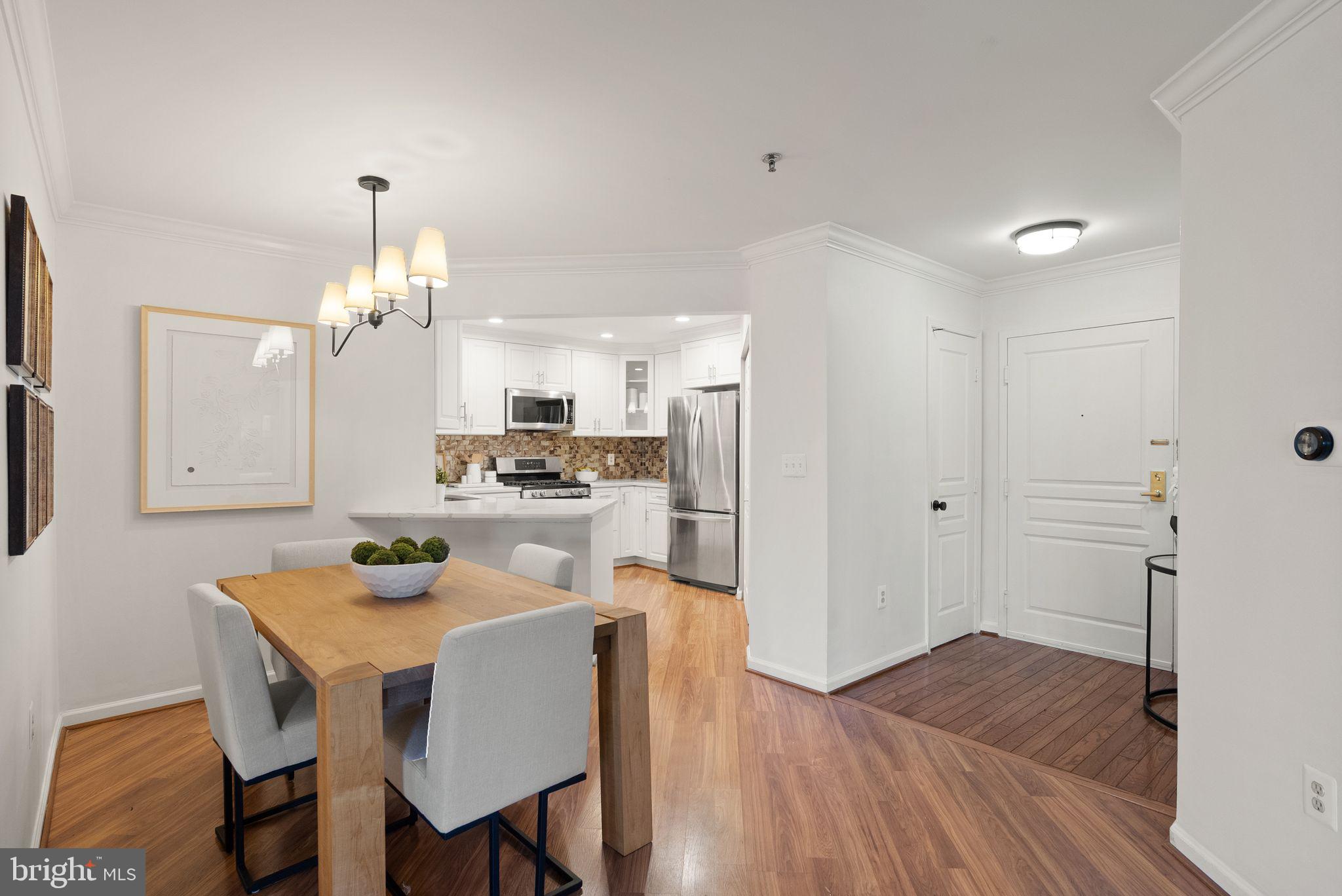 5565 Seminary Road, Unit 209 Falls Church, VA 22041 - Photo 2 of 34 a kitchen with a table and chairs in it