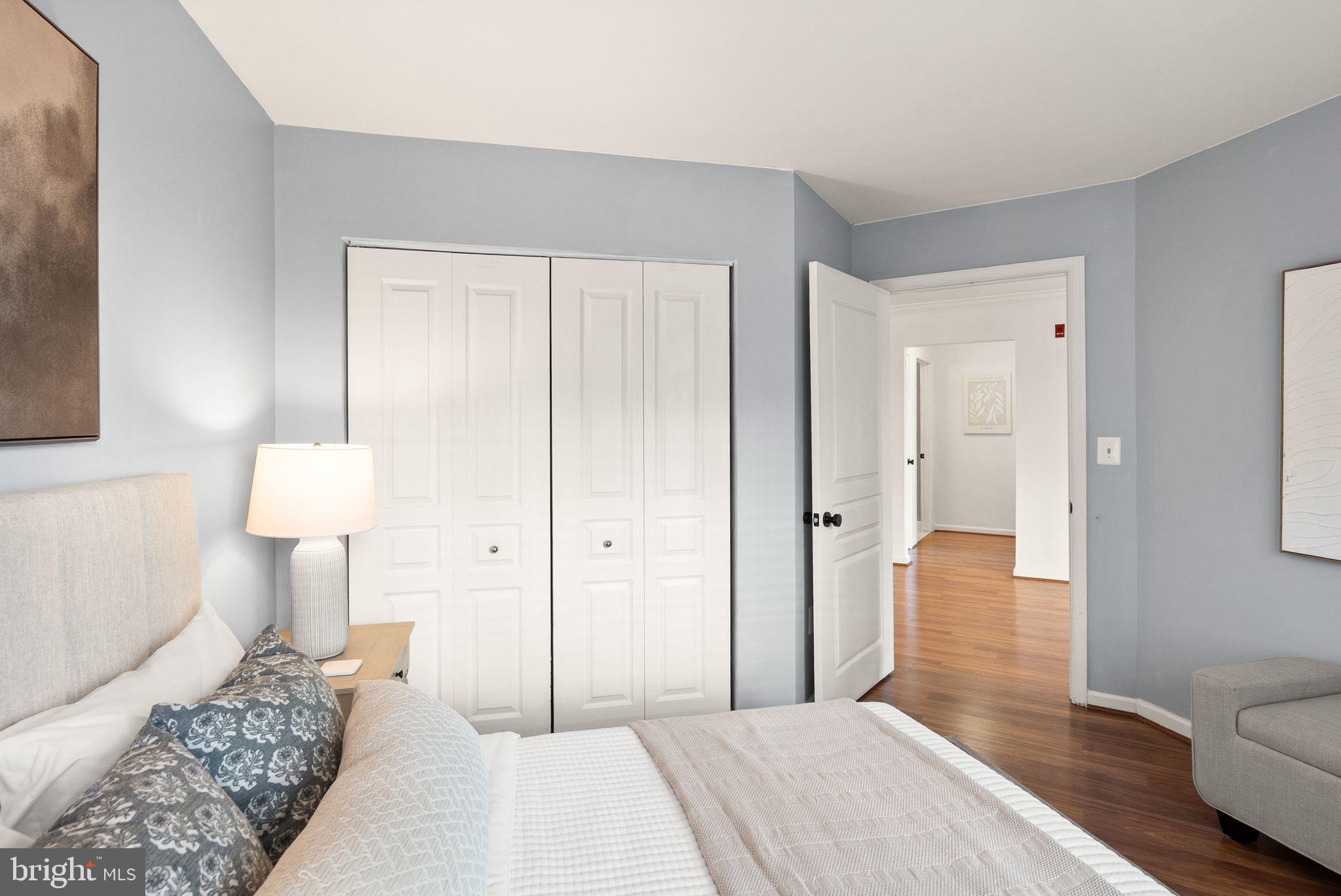 5565 Seminary Road, Unit 209 Falls Church, VA 22041 - Photo 22 of 34 a bedroom with a bed and a lamp