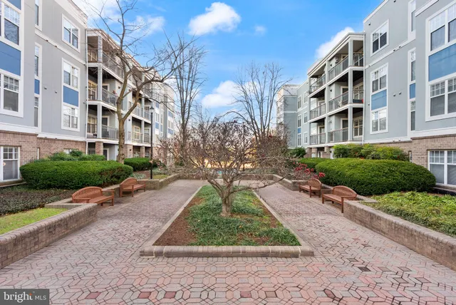 a view of a building with a yard